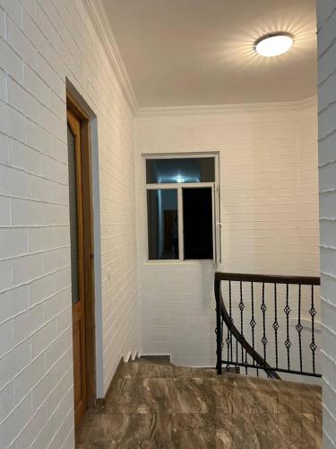 an empty room with a window in a building at Olesya Guesthouse in Mtsvane Kontskhi