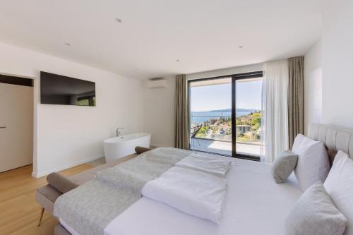 Posteľ alebo postele v izbe v ubytovaní Carmen Residence Apartments