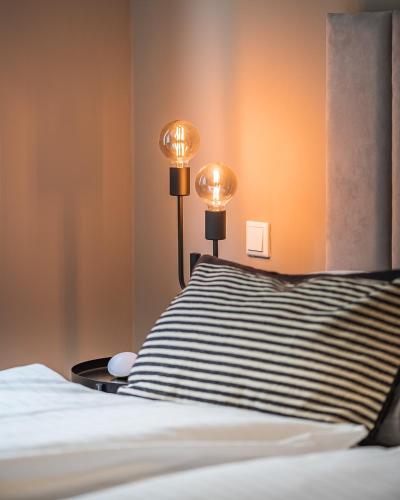 Ένα ή περισσότερα κρεβάτια σε δωμάτιο στο Eddie’s Design Apartments