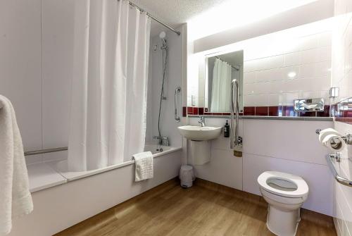 a bathroom with a toilet and a sink and a shower at Days Inn Hotel Gretna Green in Gretna Green
