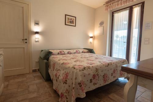 Postel nebo postele na pokoji v ubytování Rosa di Assisi