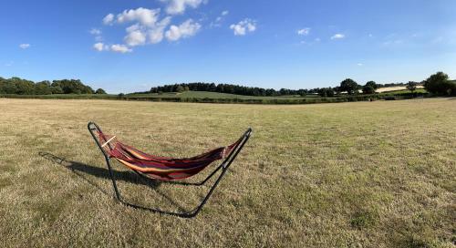 a hammock sitting in the middle of a field at Dukeries Retreat in Retford