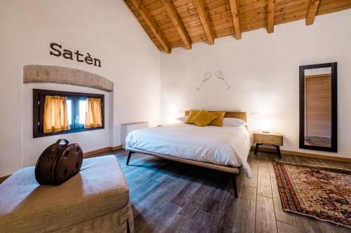 a bedroom with a bed in a room with wooden ceilings at SMART San Martino in Paratico