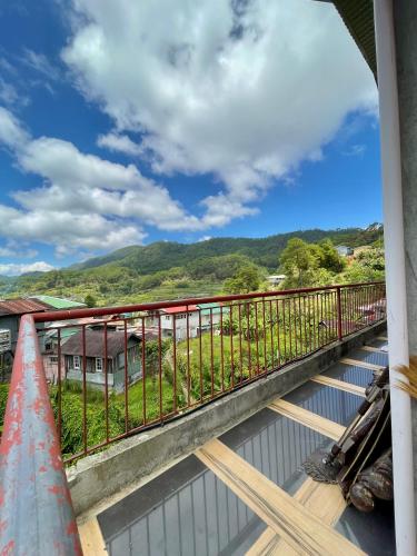 a balcony with a view of the mountains at Andrew & Mary's Lodging House in Sagada