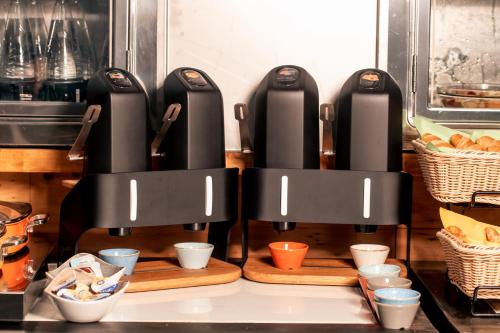 a kitchen with two black heaters on a counter at K MODERN HOTEL in Peschiera del Garda