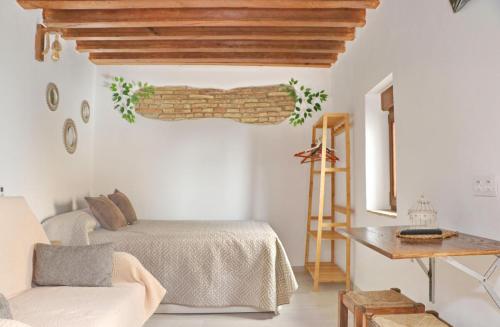 Кровать или кровати в номере Estudio La Piedra