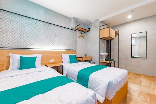Katil atau katil-katil dalam bilik di Ultima Guest House