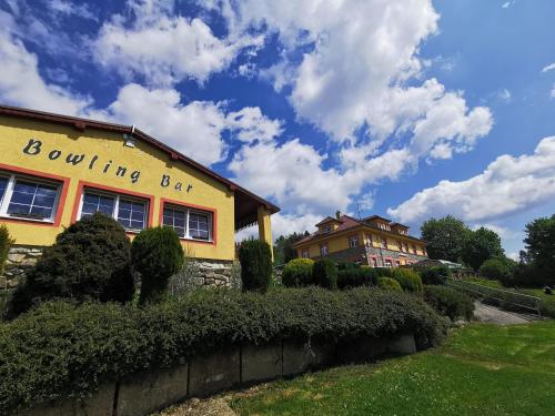 a yellow building with a building bar written on it at Pension Vyhlídka in Přední Výtoň