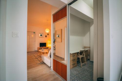a large mirror in a room with a bedroom at LUMIN 4 in Senj