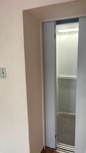 an open door to a room with a glass door at Sanatoriy Samara in Samarske Village