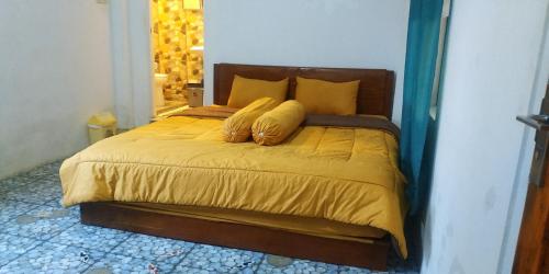 Postel nebo postele na pokoji v ubytování Lobster Homestay