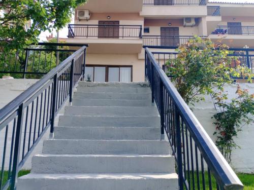 a set of stairs in front of a building at Papas Studios in Skala Marion