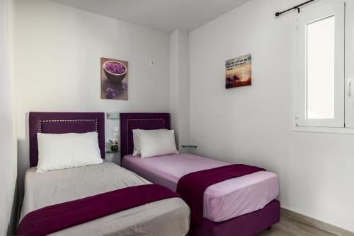 two beds sitting next to each other in a room at Delight Corfu Apart Hotel, Sidari in Sidari