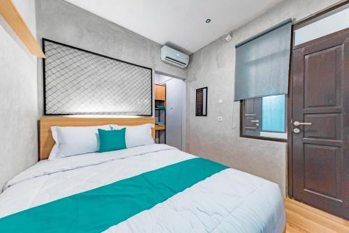 Katil atau katil-katil dalam bilik di Ultima Guest House