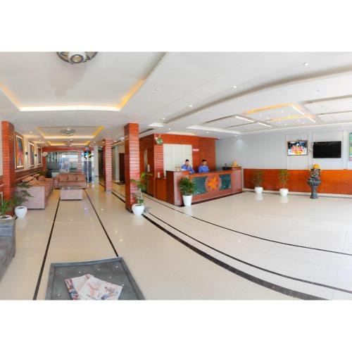 a bowling alley in a mall with people in it at The Royal Bhumesh in Katra