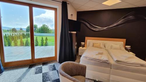 Postel nebo postele na pokoji v ubytování Apartmány Dačice
