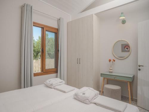 Ένα ή περισσότερα κρεβάτια σε δωμάτιο στο Villa Terra - Laganas Stone Villas