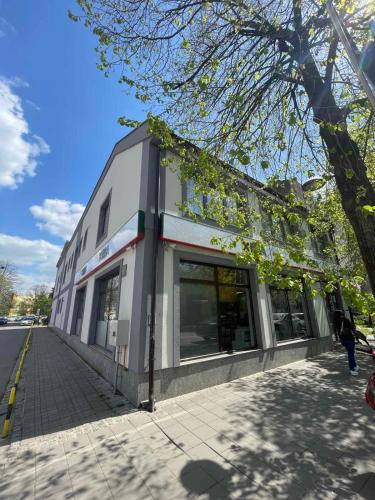 a building on the side of a street at Morpheus apartmani in Sremska Mitrovica
