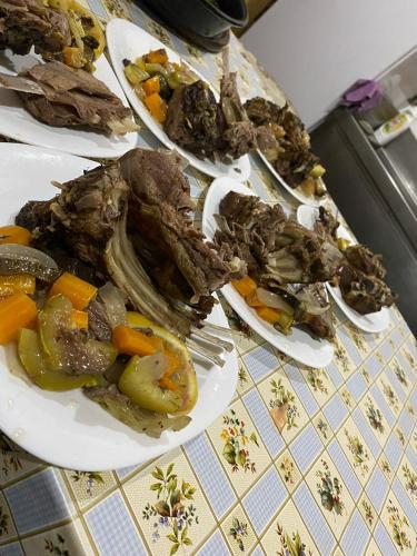 a group of plates of food on a table at Villa Belinis in Theth