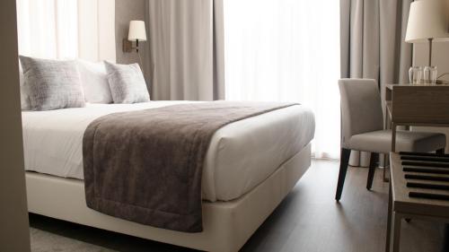Katil atau katil-katil dalam bilik di MASA Hotel & Spa Campo Grande Collection