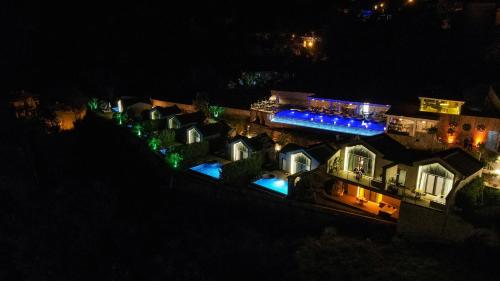 an aerial view of a house at night at Vista Del Amor Faralya in Fethiye