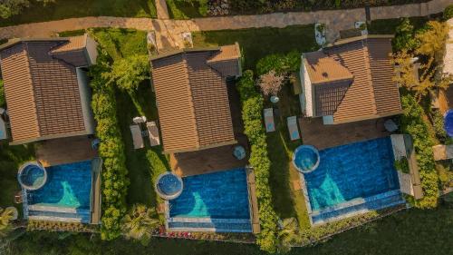 an overhead view of a resort with two swimming pools at Vista Del Amor Faralya in Fethiye