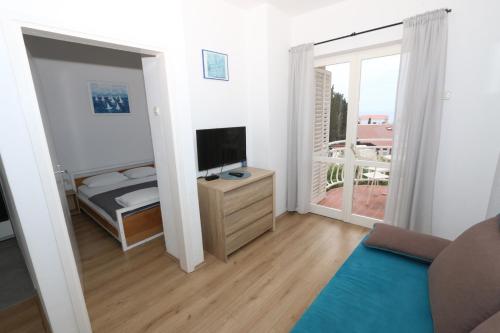 Μια τηλεόραση ή/και κέντρο ψυχαγωγίας στο APARTMAN TIN