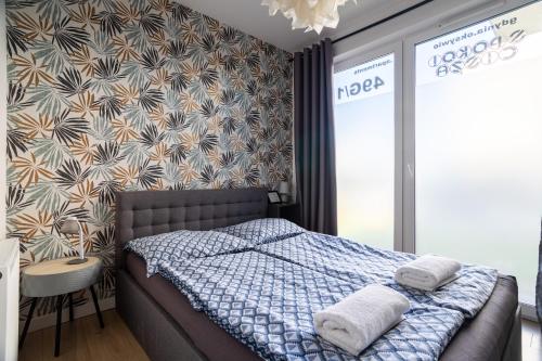 Posteľ alebo postele v izbe v ubytovaní Apartamenty Cisza & Spoko! - ACCO RENT