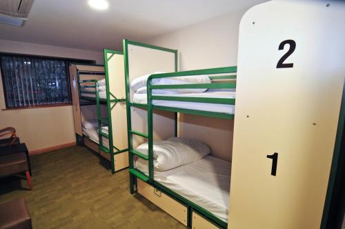 
a bunk bed with two bunk beds in a room at Savoy Hostel Galway City Centre in Galway
