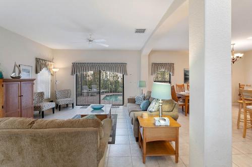 a living room with a couch and a table at Paradise Resort Styles 4 BEDROOMS with 3 baths Pool and SPA in Orlando