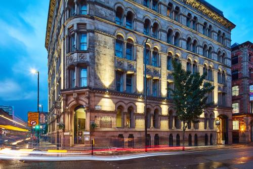 a large building on the corner of a street at The Townhouse Manchester in Manchester