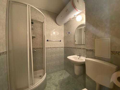 a bathroom with a shower and a sink at GT Sunny Fort Apartments in Sunny Beach