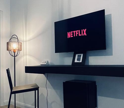 TV a/nebo společenská místnost v ubytování Carducci 83
