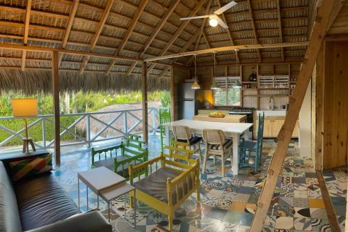 a kitchen and living room with a table and chairs at Cabarete Breeze in Cabarete