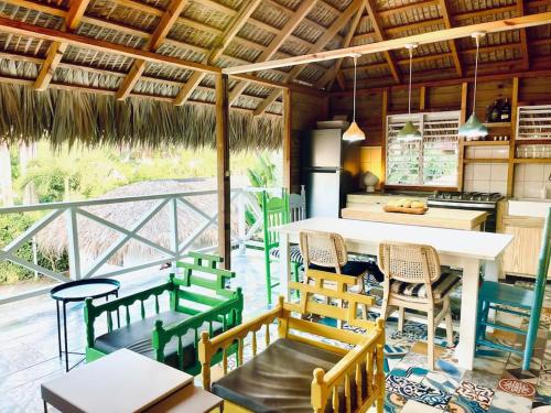 a kitchen and dining room with a table and chairs at Cabarete Breeze in Cabarete