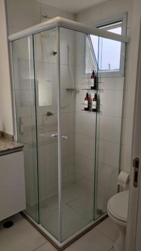 a glass shower in a bathroom with a toilet at Studio 27m2 Wifi Liberdade Proximo Metro Restaurante Hospital in São Paulo