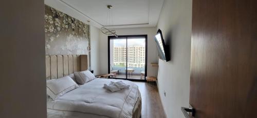 Postel nebo postele na pokoji v ubytování Le Cocon d'Oasis avec piscine - Location journalière Casablanca