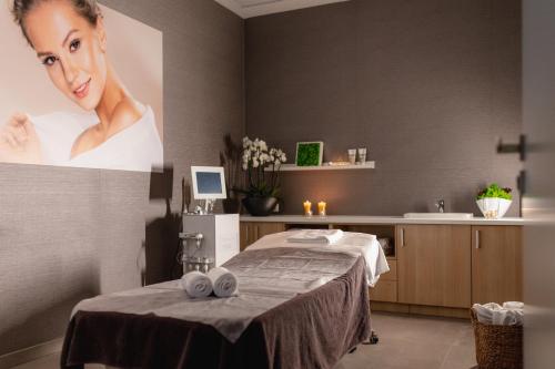 a rendering of a spa room with a woman on the wall at Platinum Mountain Hotel&SPA in Szklarska Poręba