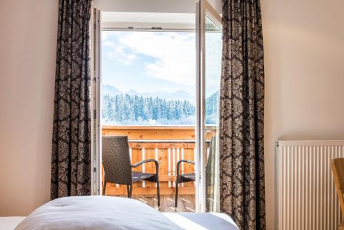 Postel nebo postele na pokoji v ubytování Hotel Antholzerhof
