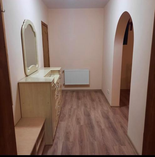 a bathroom with a sink and a mirror at Готельно- банний комплекс Афродіта in Nyzhni Mlyny
