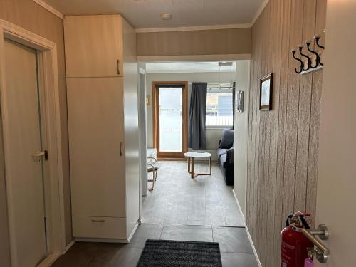 a hallway leading to a room with a living room at The Painter's house with view and balcony in Siglufjörður