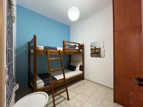 a bunk bed room with two bunk beds at Mediterranean Dolphin Guest House in Paránimfoi