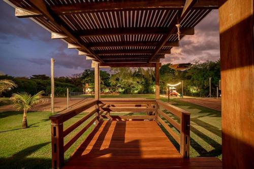 a wooden porch with awning in a park at Bonito Ecotel in Bonito
