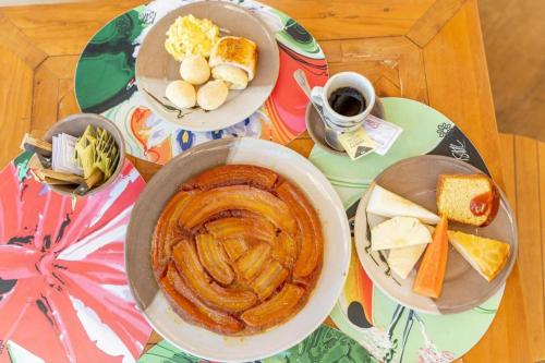 a table with plates of food and a bowl of soup at Bonito Ecotel in Bonito