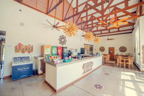 a large room with a counter and a dining room at Bonito Ecotel in Bonito