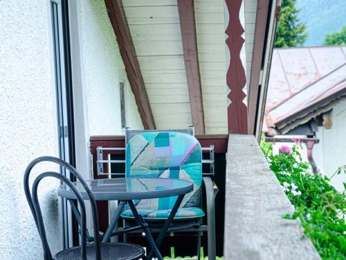 a table and chairs on the porch of a house at Gästehaus Tannenberg in Bayerisch Gmain