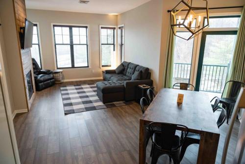 a living room with a couch and a table at The Appalachian at Mountain Creek in Vernon