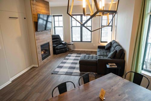 a living room with a couch and a fireplace at The Appalachian at Mountain Creek in Vernon