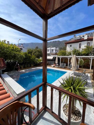 a view from the balcony of a villa with a swimming pool at Yelken Hotel Akyaka in Akyaka