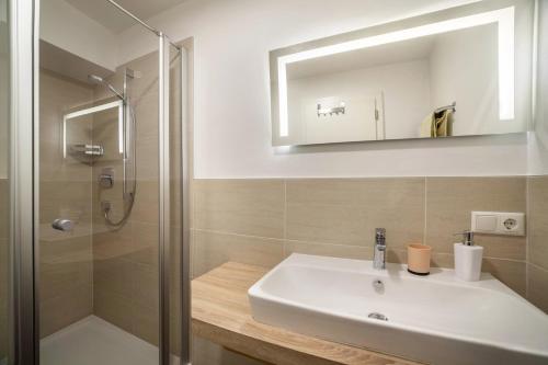 a bathroom with a sink and a shower at Residence Alpina Comfort Nr 1 in Tesimo